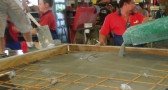 Cellular concrete placed into a steel mould over reinforcement mesh
